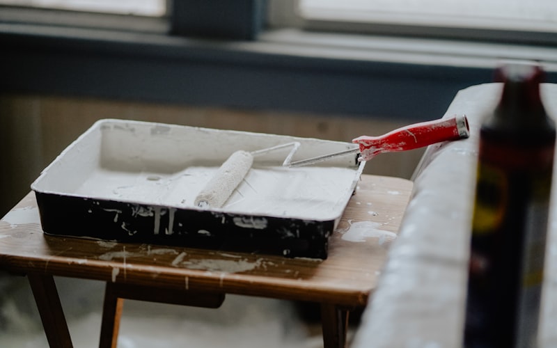 Painting a living room wall with a roller, interior paint